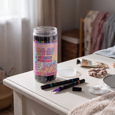 Novum Nail Art Pens Set: clear tub of 12 dual-ended pens on a dressing table with two pens and a cap beside it