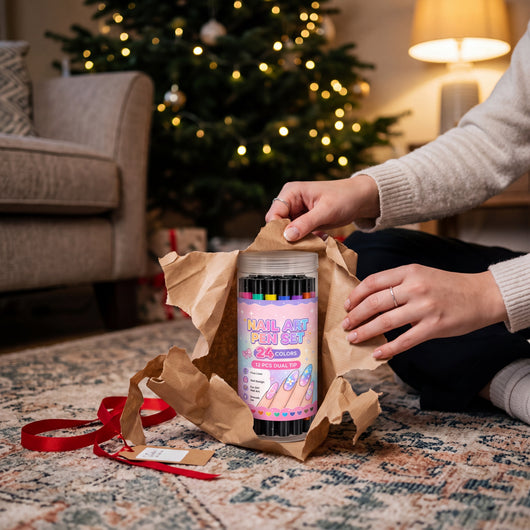 Novum Nail Art Pens Set being unwrapped from kraft paper under a Christmas tree