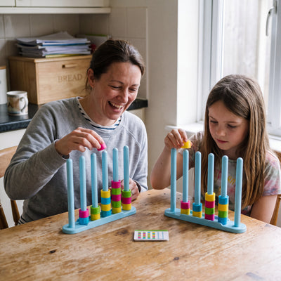 Mother and daughter racing with the Color Ring Stack Race Game
