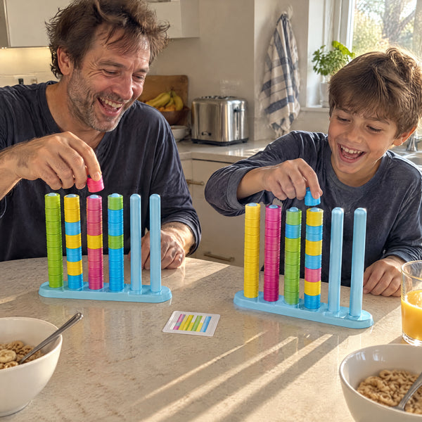 Father and son racing on the ring stack game at the breakfast counter