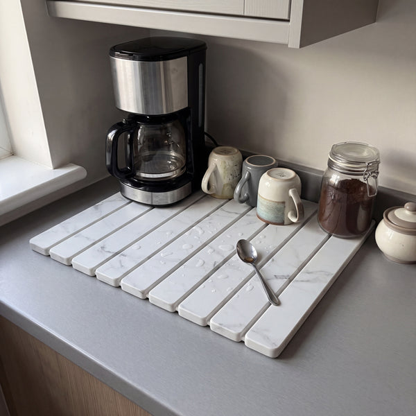 Stone dish drying mat used as a coffee station with mugs drying