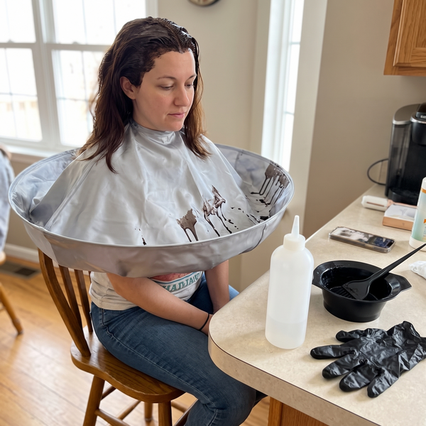 Hair dye at the kitchen counter with the Hair Catcher Cutting Cape